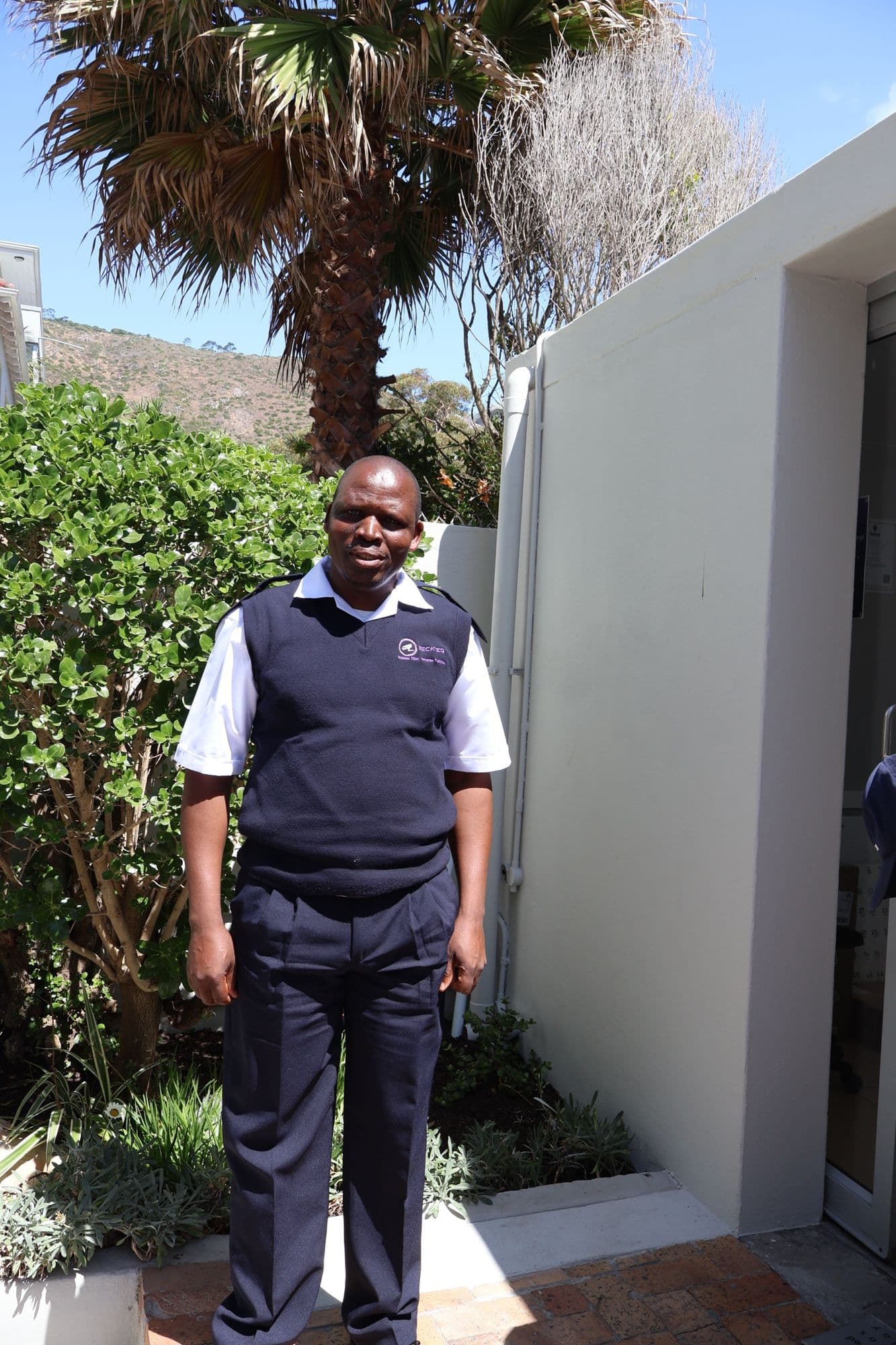 A SecaTeq security officer at a residential entrance