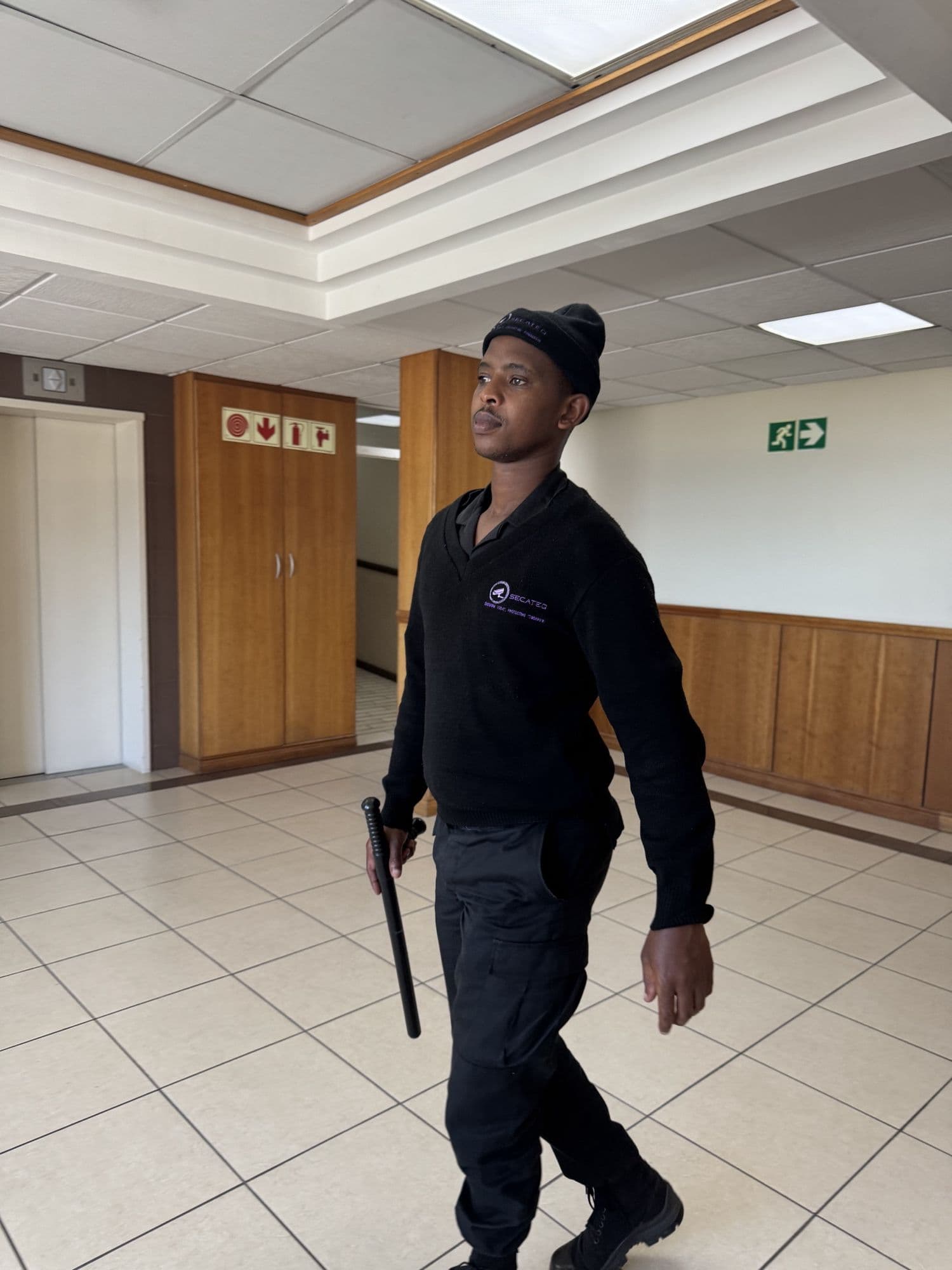A SecaTeq officer walking a corridor on his rounds